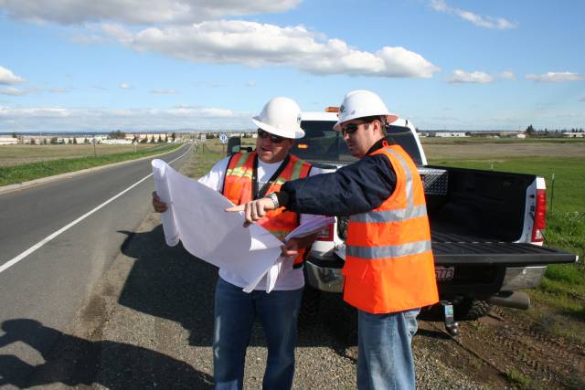 Crew reviewing traffic control plans